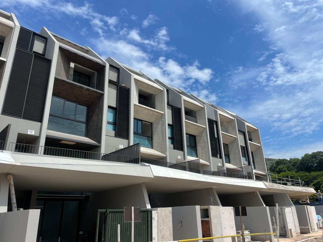 Off-form concrete facades on a row of completed townhouses
