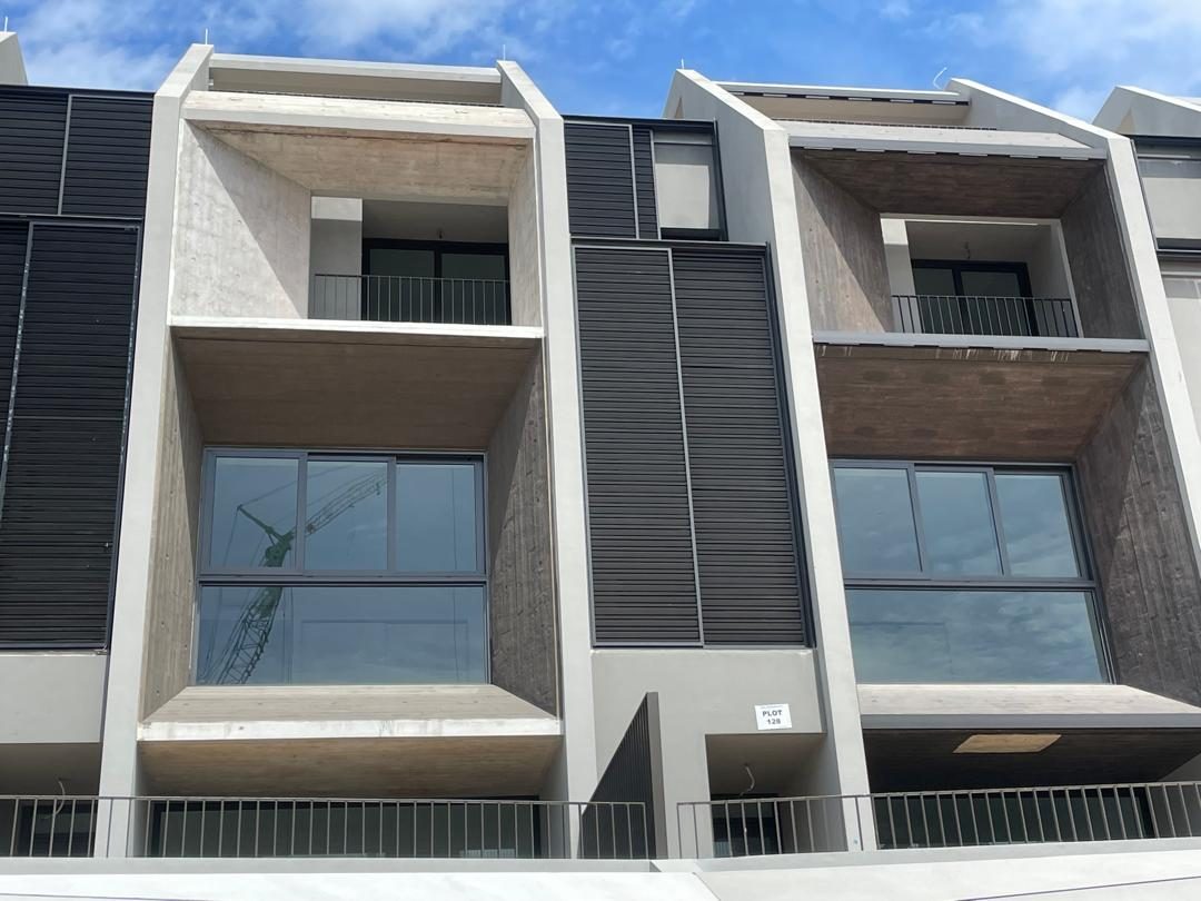 Off-form concrete frames and ledges on a finished facade