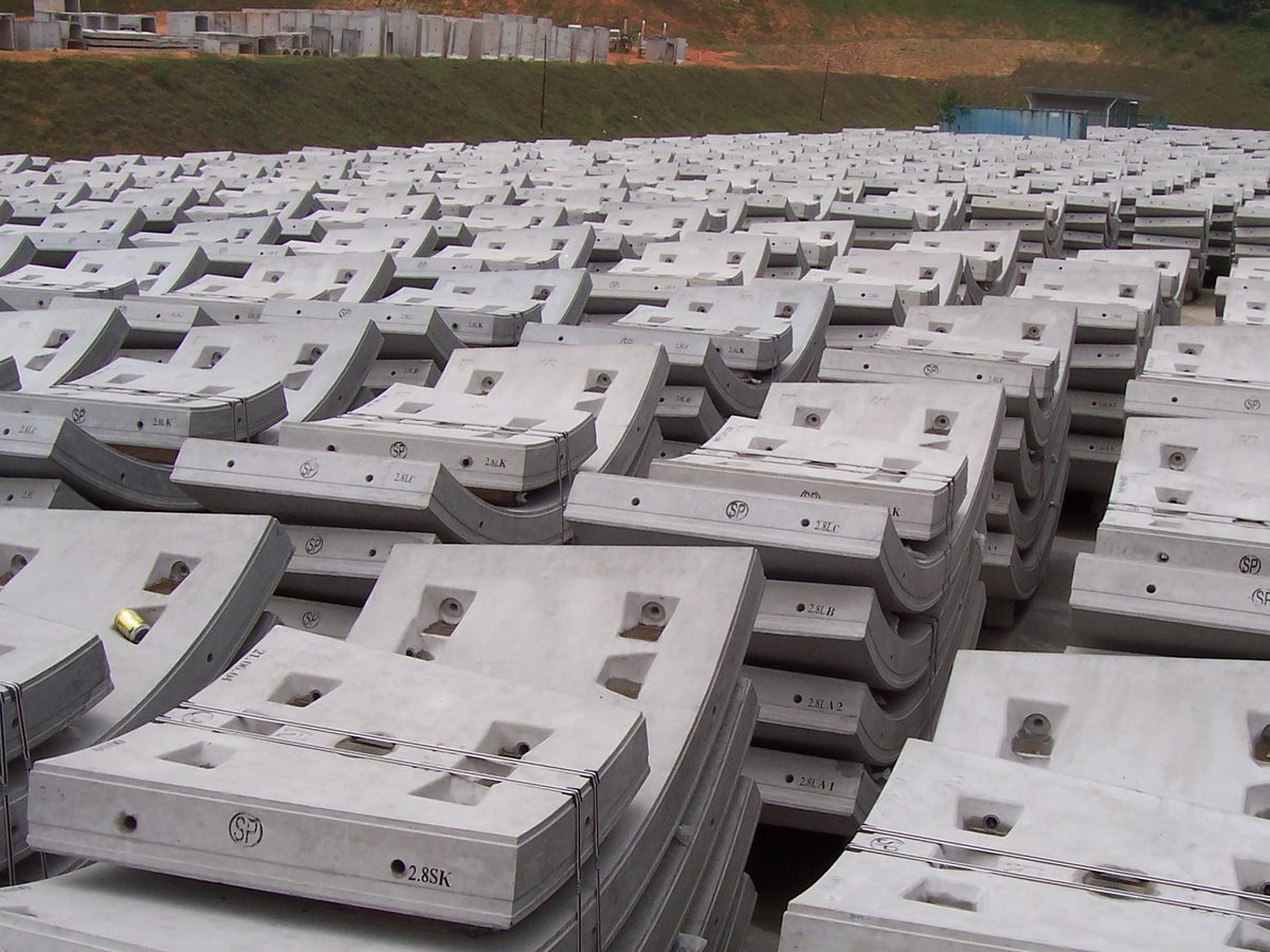 Rows of precast tunnel lining segments stacked in the storage yard
