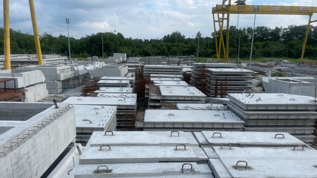 Gantry crane over the storage yard with precast components stacked in rows